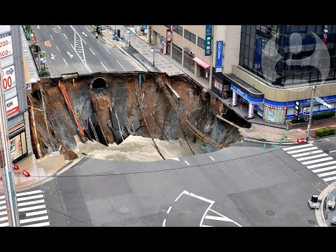 Enormous sinkhole swallows large section of Japanese street